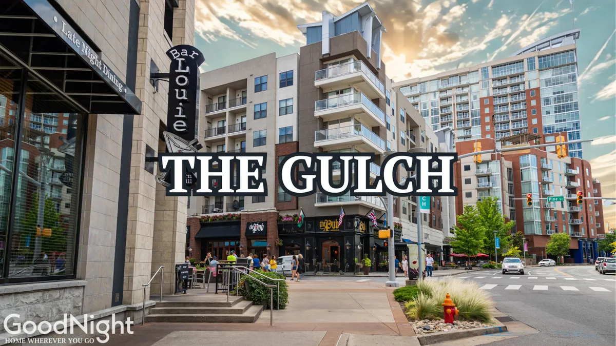 Street-level exterior scene featuring Bar Louie and modern apartment buildings. Pedestrians can be seen socializing, while the architecture and plaza convey a lively urban environment, perfect for dining, networking, and after-work relaxation.